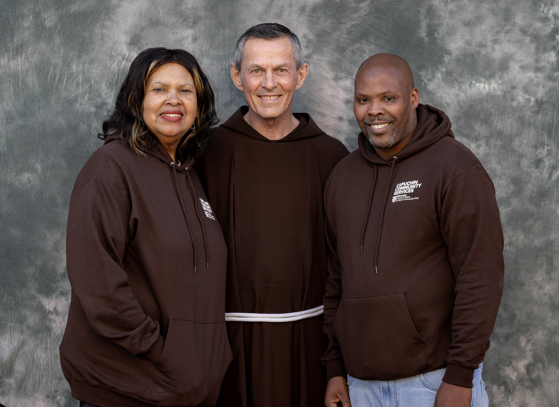 Linda Barnes, Fr. Mike Bertram and Kenny Howard
